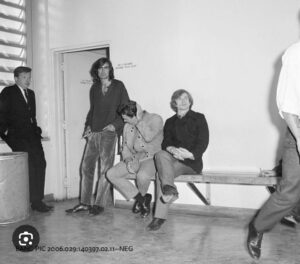 Rudolf Nureyev at police station, seated at right